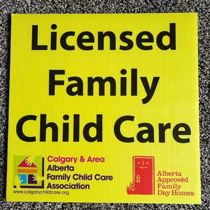 The yellow Licensed Family Child Care sign from the Calgary and Area Alberta Family Child Care Association, marked Alberta Approved Family Day Home